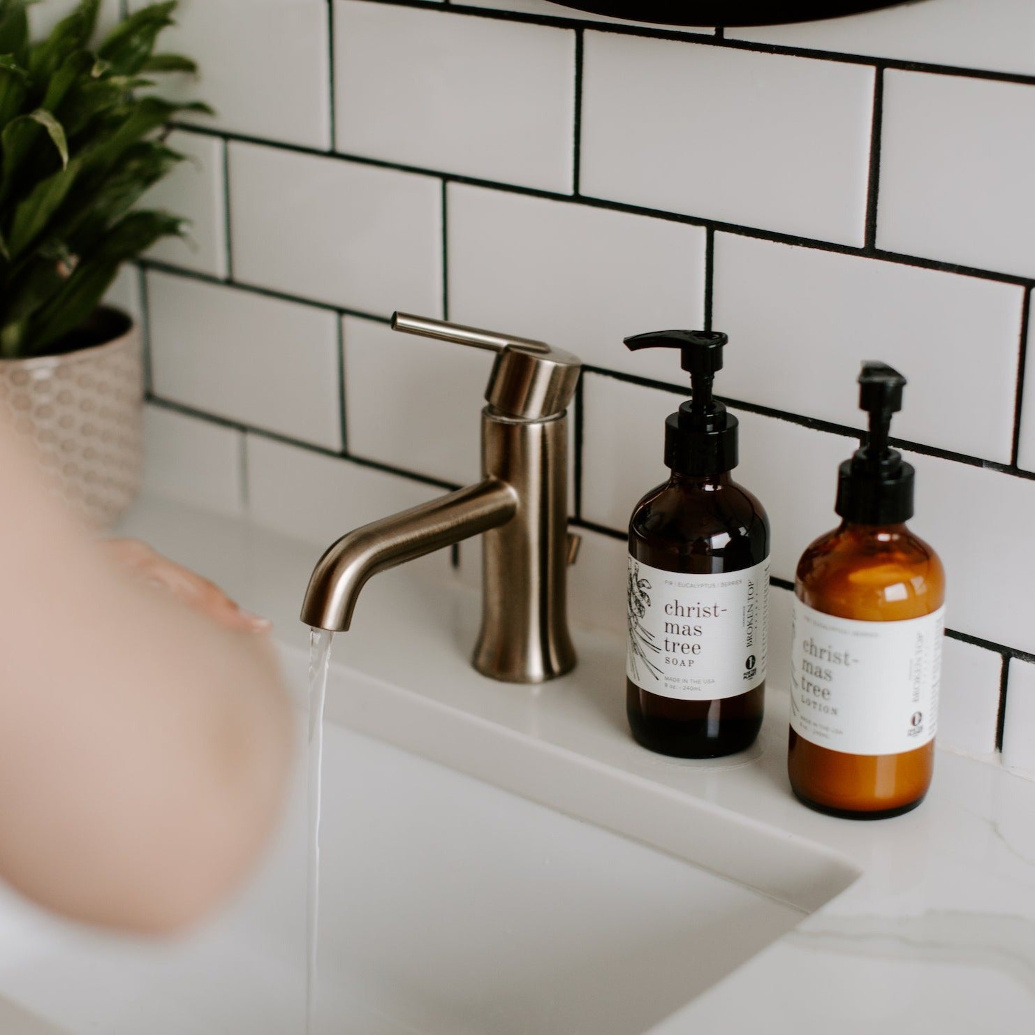 Christmas Tree 8oz liquid soap on counter next to Christmas Tree lotion