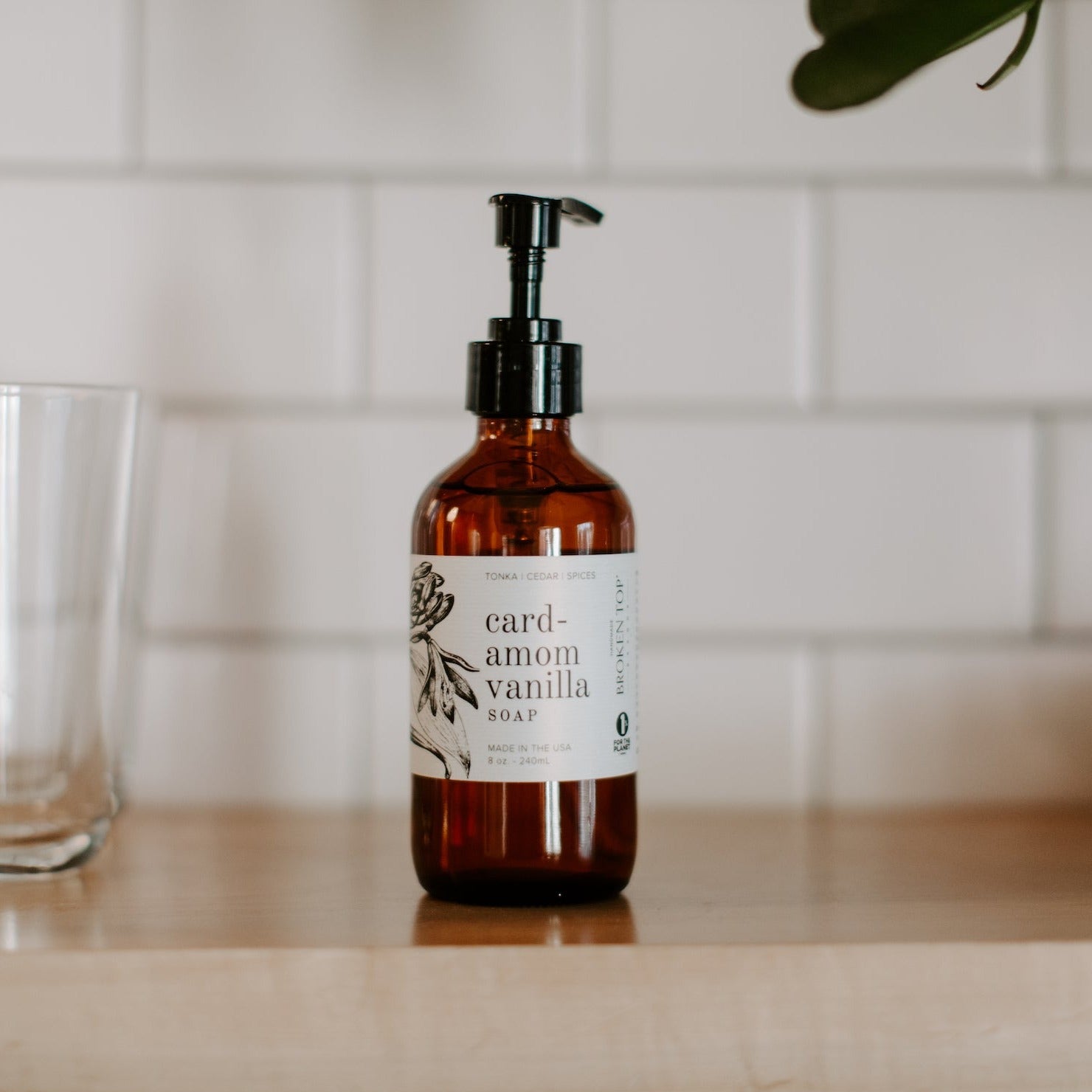 Cardamom Vanilla 8oz liquid soap on wood shelf