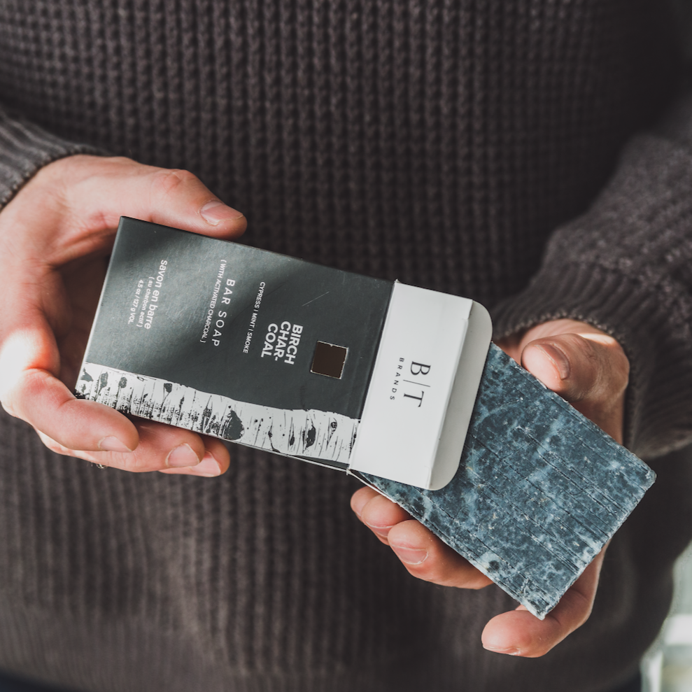 Birch Charcoal bar soap held by hands