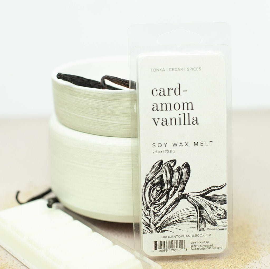 Cardamom Vanilla 2.5oz wax melts next to wax melter and vanilla