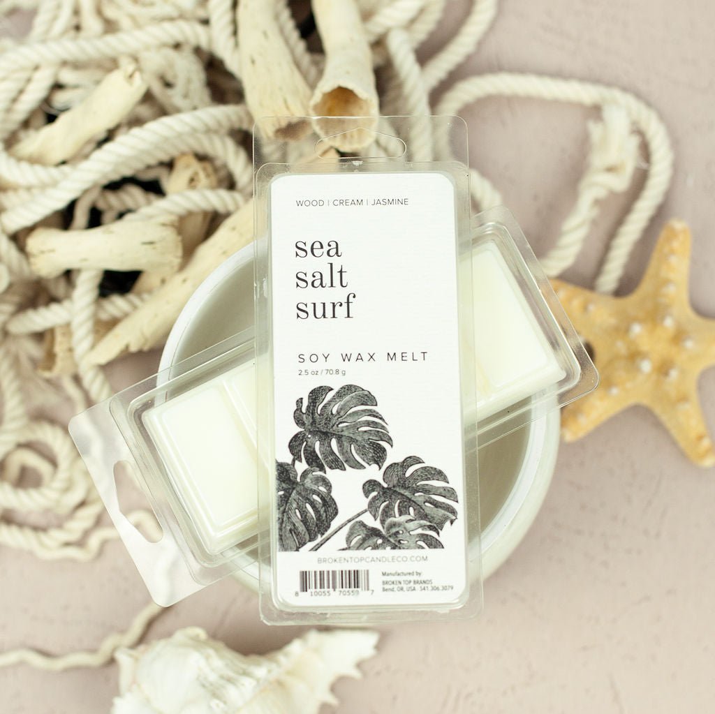 Sea Salt Surf Wax Melts resting on wax warmer and ocean items