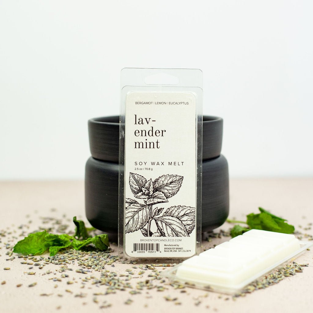 Lavender Min Wax Melts infront of black wax warmer next to lavender.