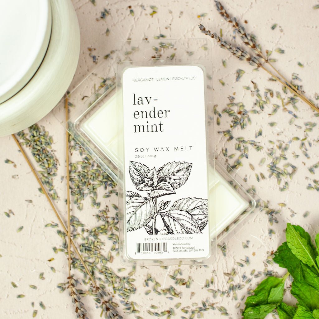Lavender Mint 2.5oz wax melts on table next to lavender, mint and wax melter