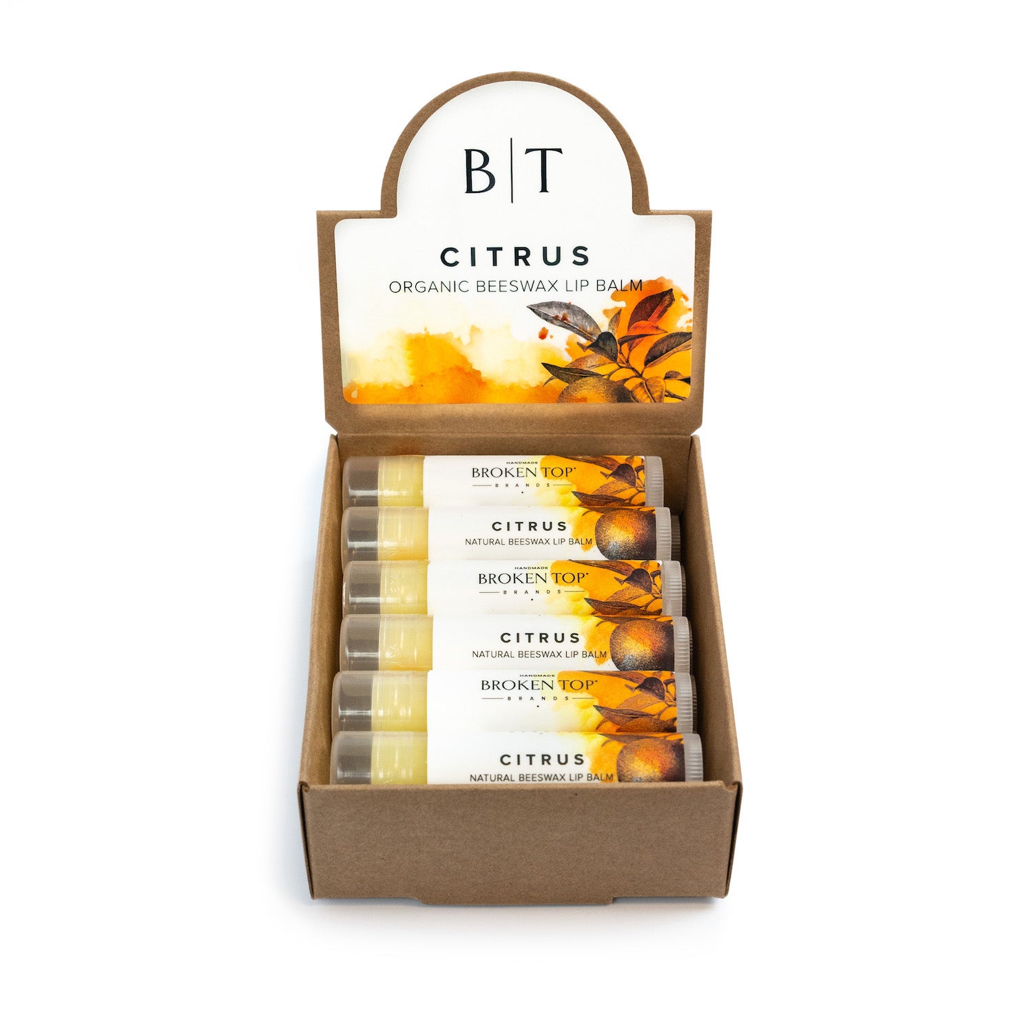Display of Broken Top Citrus lip balms in a cardboard box on a white background.