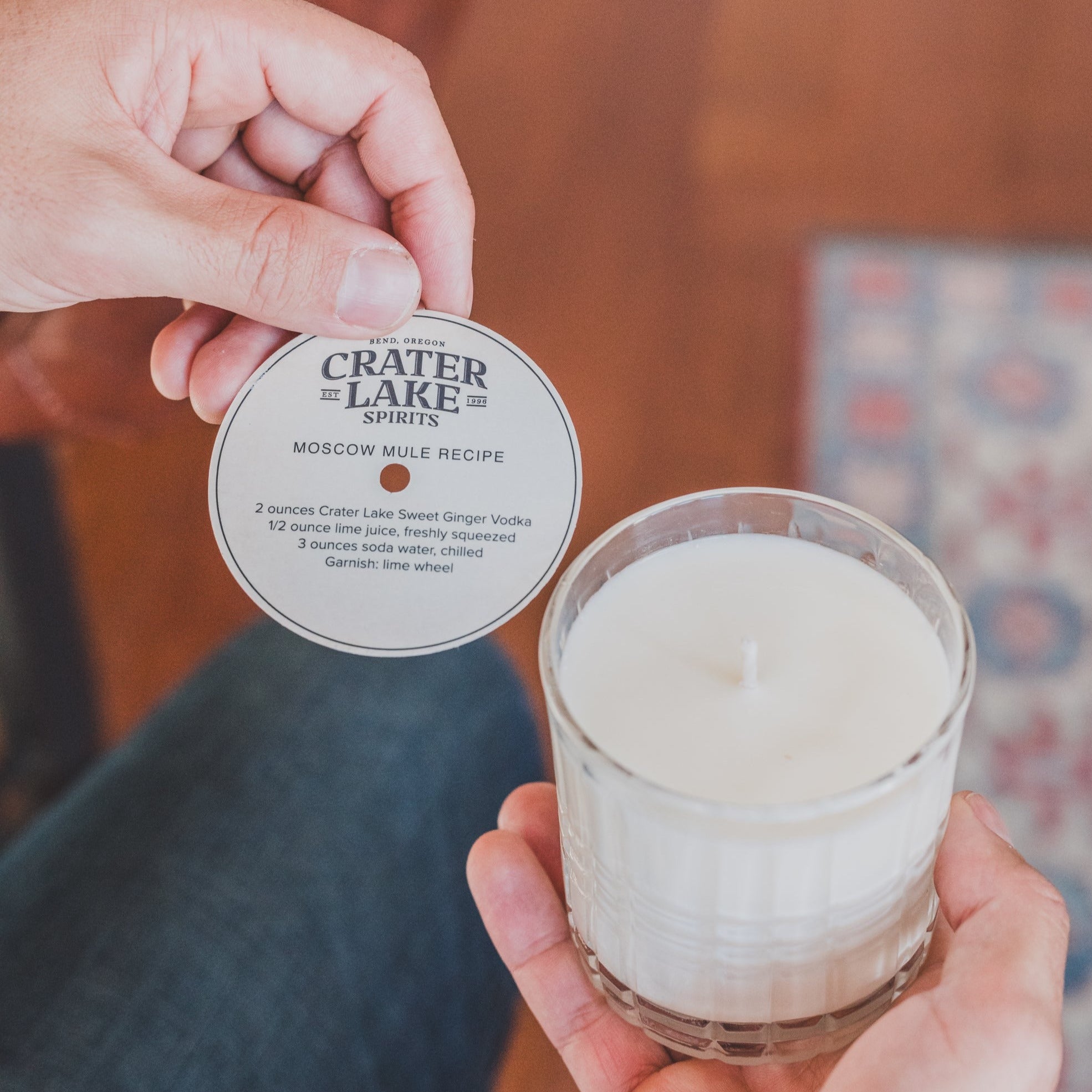 Moscow Mule 11oz candle being held by women