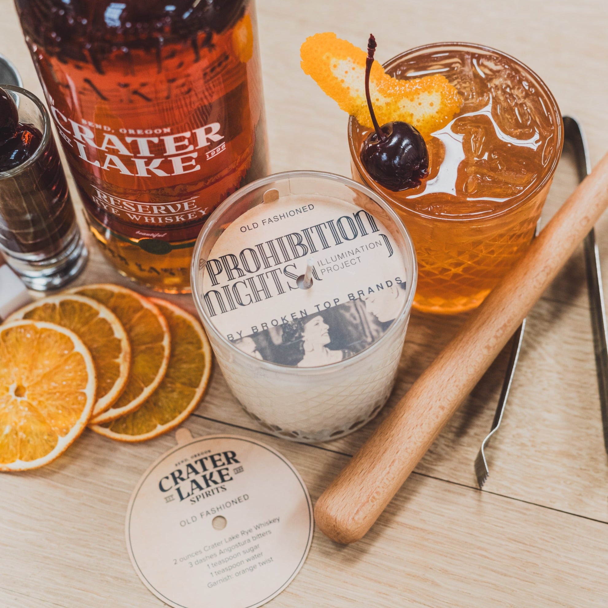 Old Fashioned 11oz candle on table next to drinks