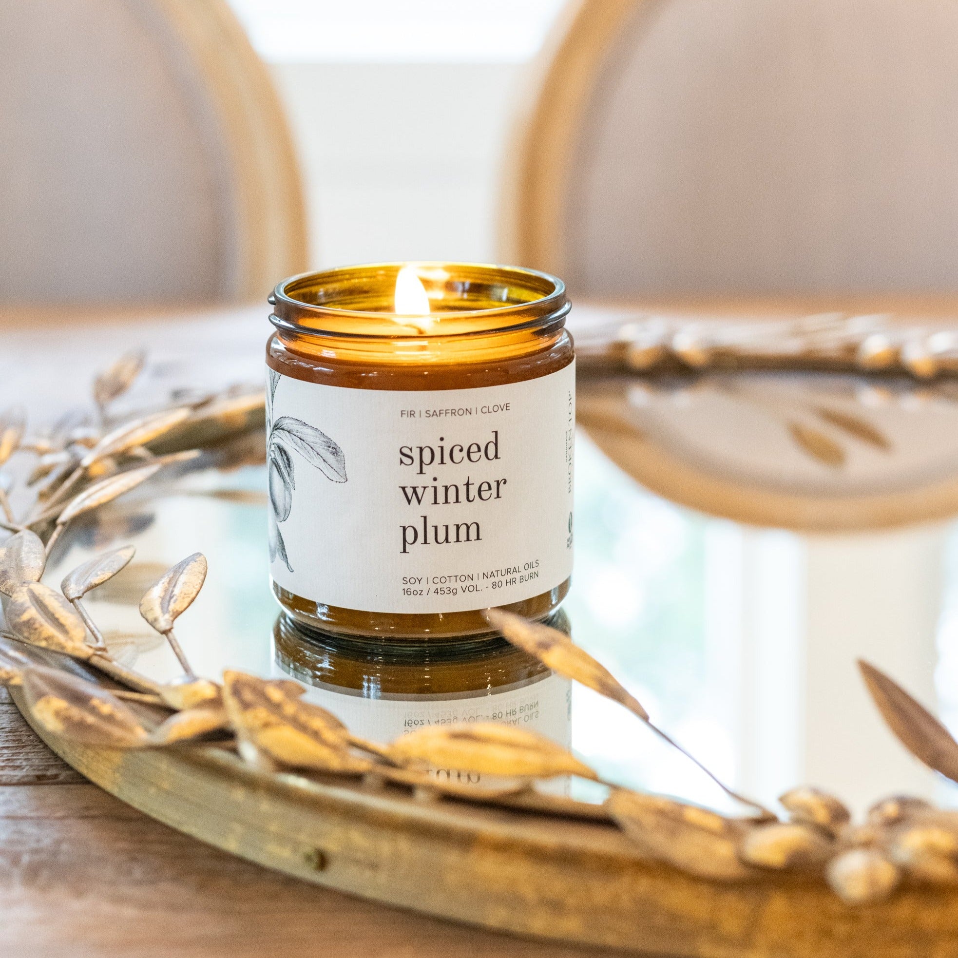16oz Spiced Winter Plum candle on mirror