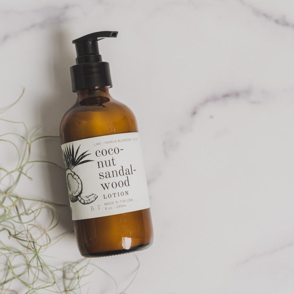 Coconut Sandalwood 8oz lotion on marble