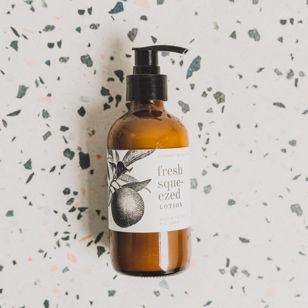 Cranberry Orange 8oz lotion on black and white table