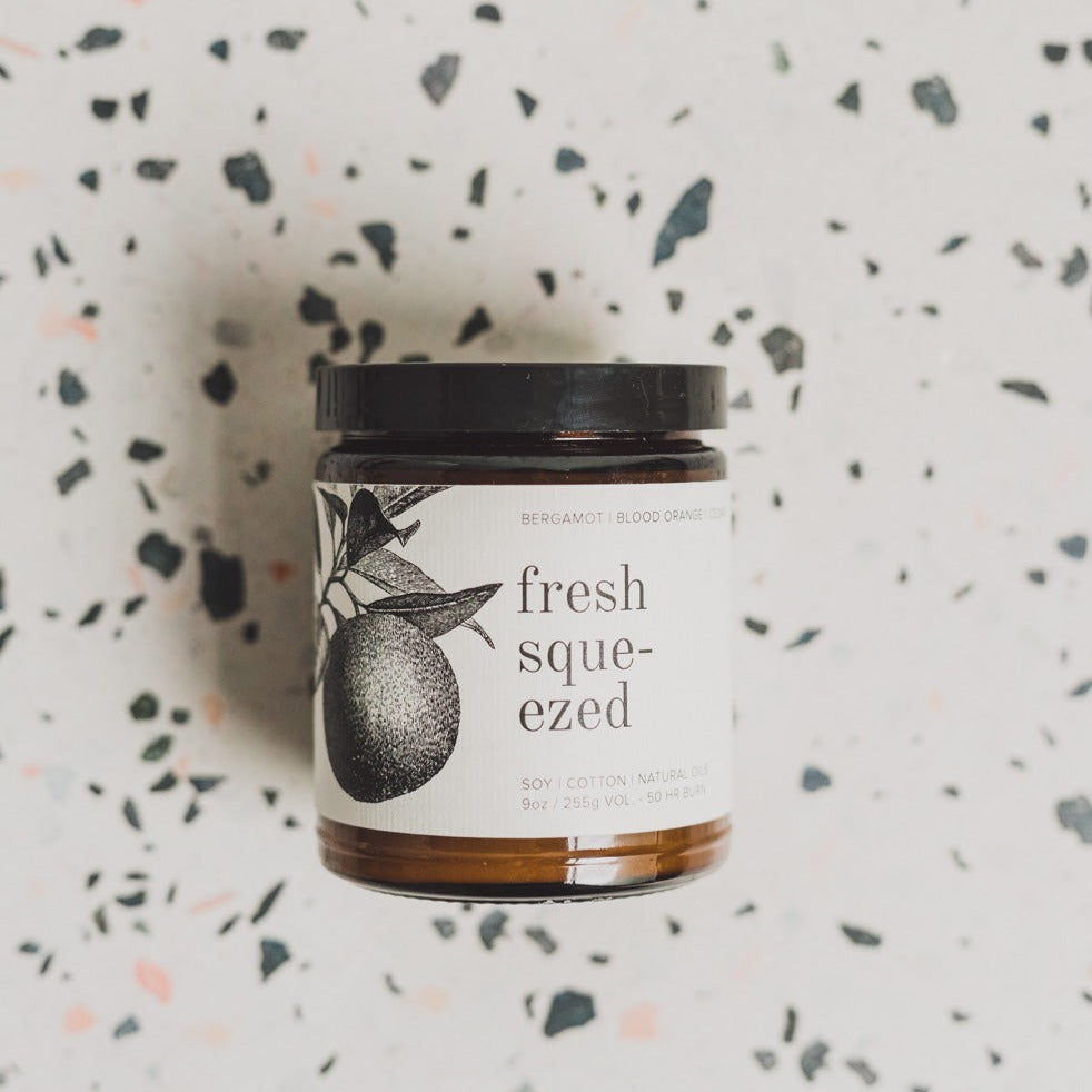 9oz Fresh Squeezed candle on white and black table