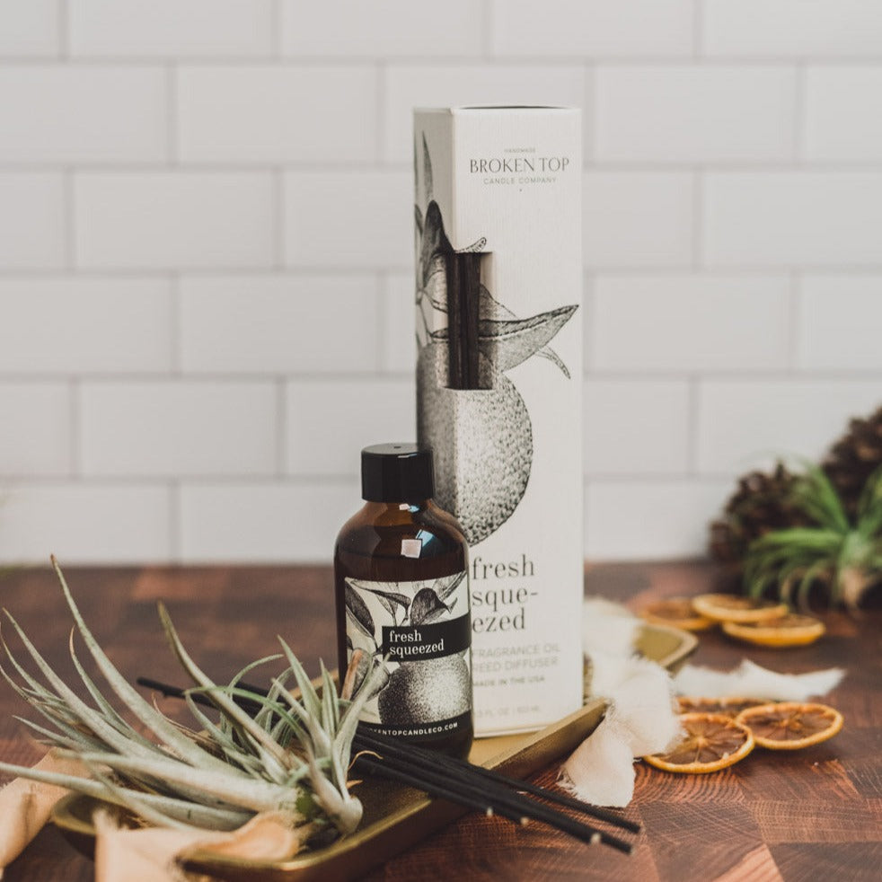Fresh Squeezed Reed diffuser and box on wood table and dried decor