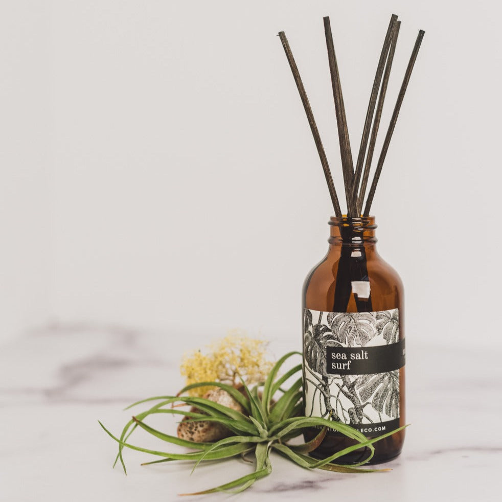 Sea Salt Surf Reed diffuser and box on white marble