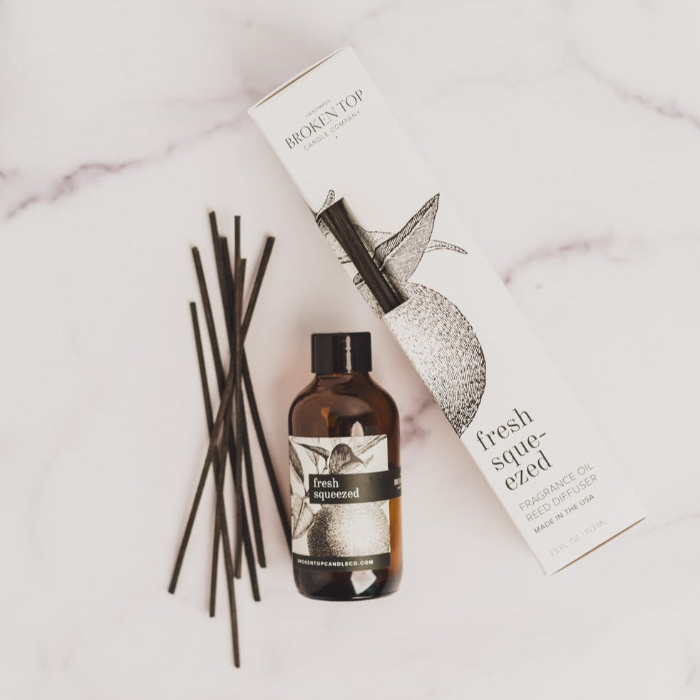 Fresh Squeezed Reed diffuser on white marble table