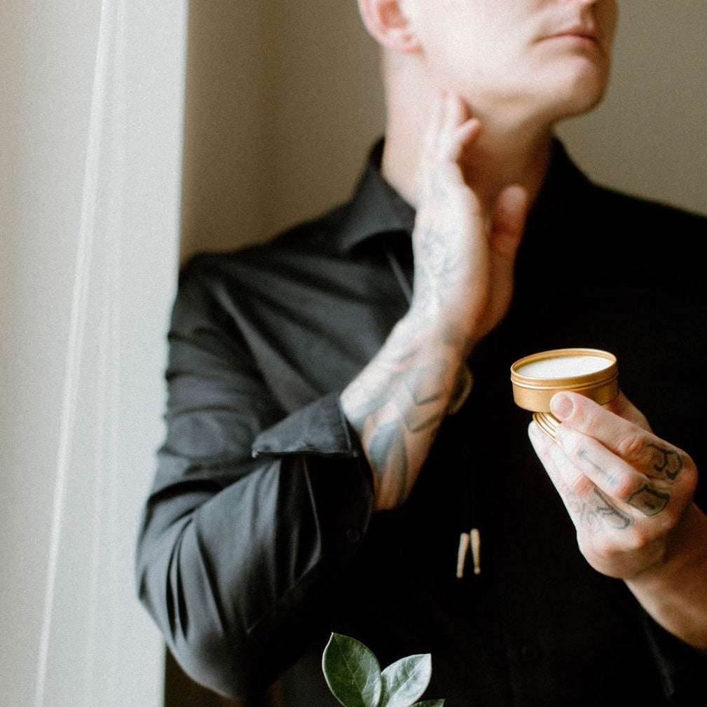 Tobacco Teak solid cologne being held by gentleman