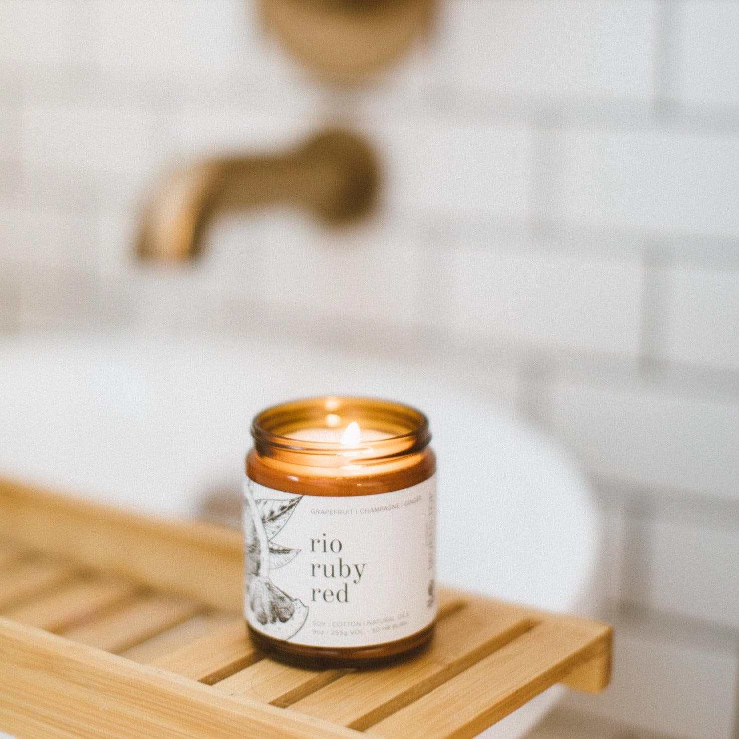 9oz Rio Ruby Red candle on wood shelf