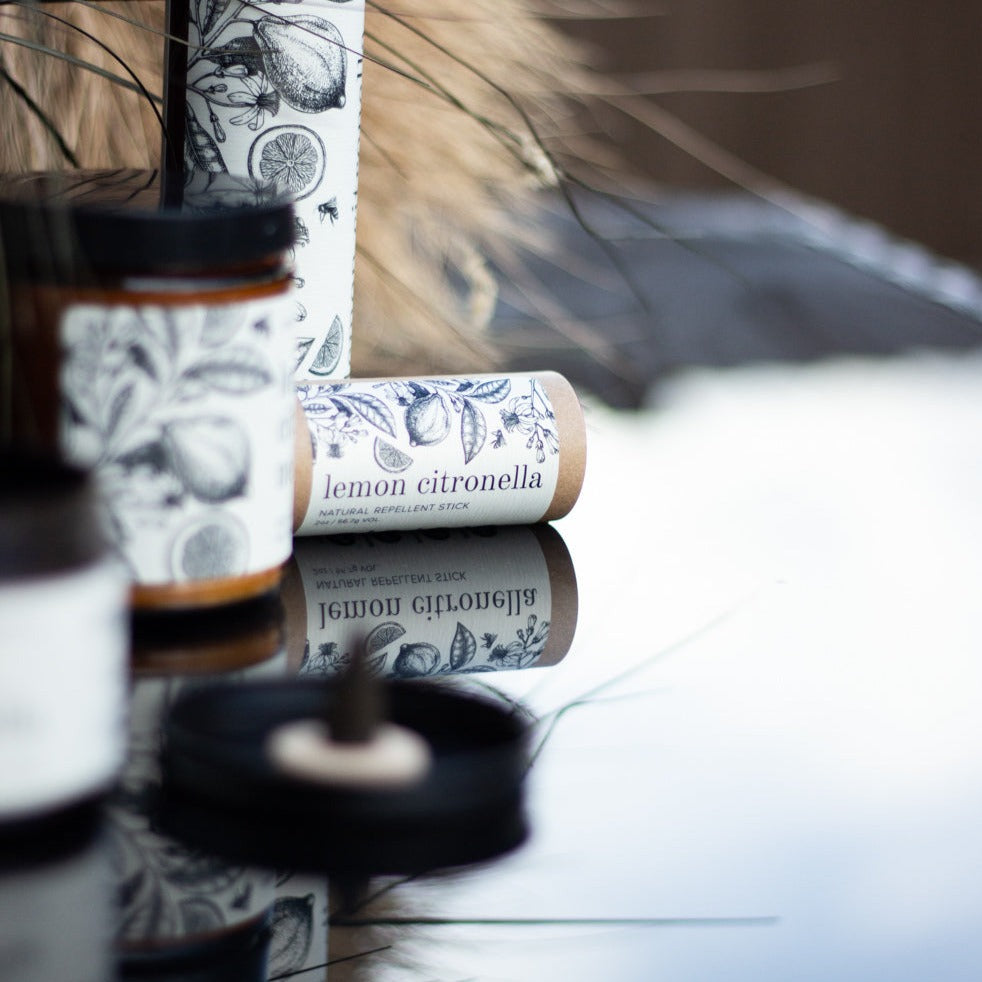 Lemon Citronella incense kit on black glass