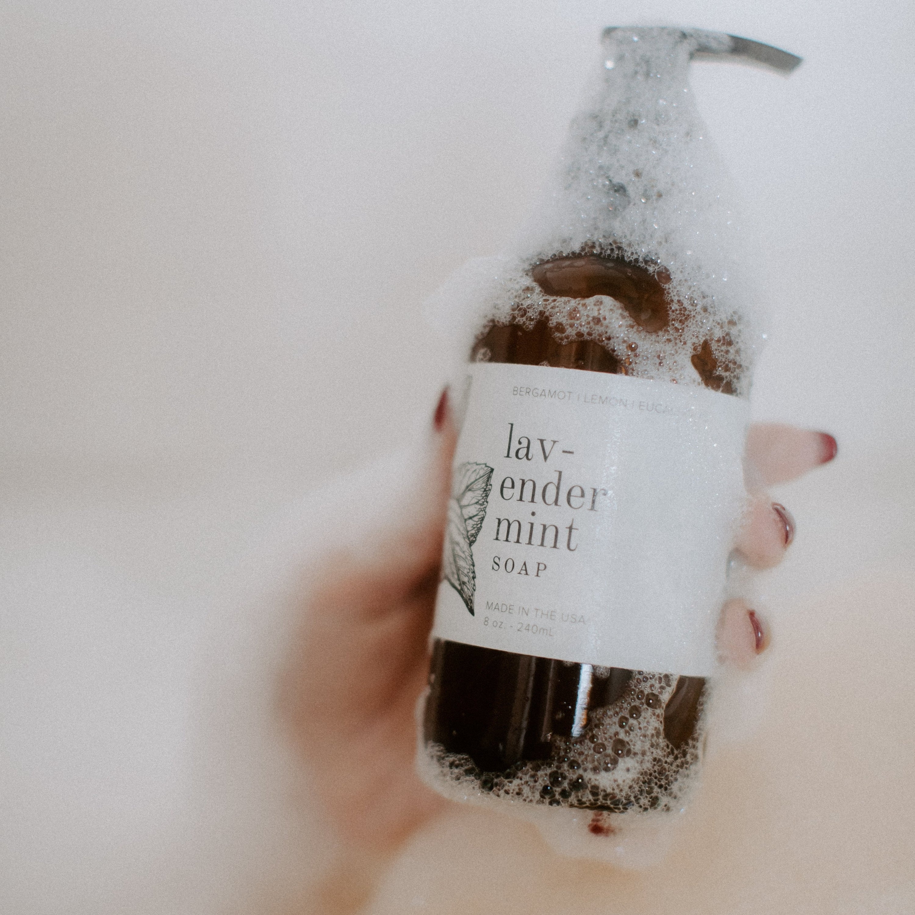 Soapy Lavender Mint 8oz liquid soap in women's hand