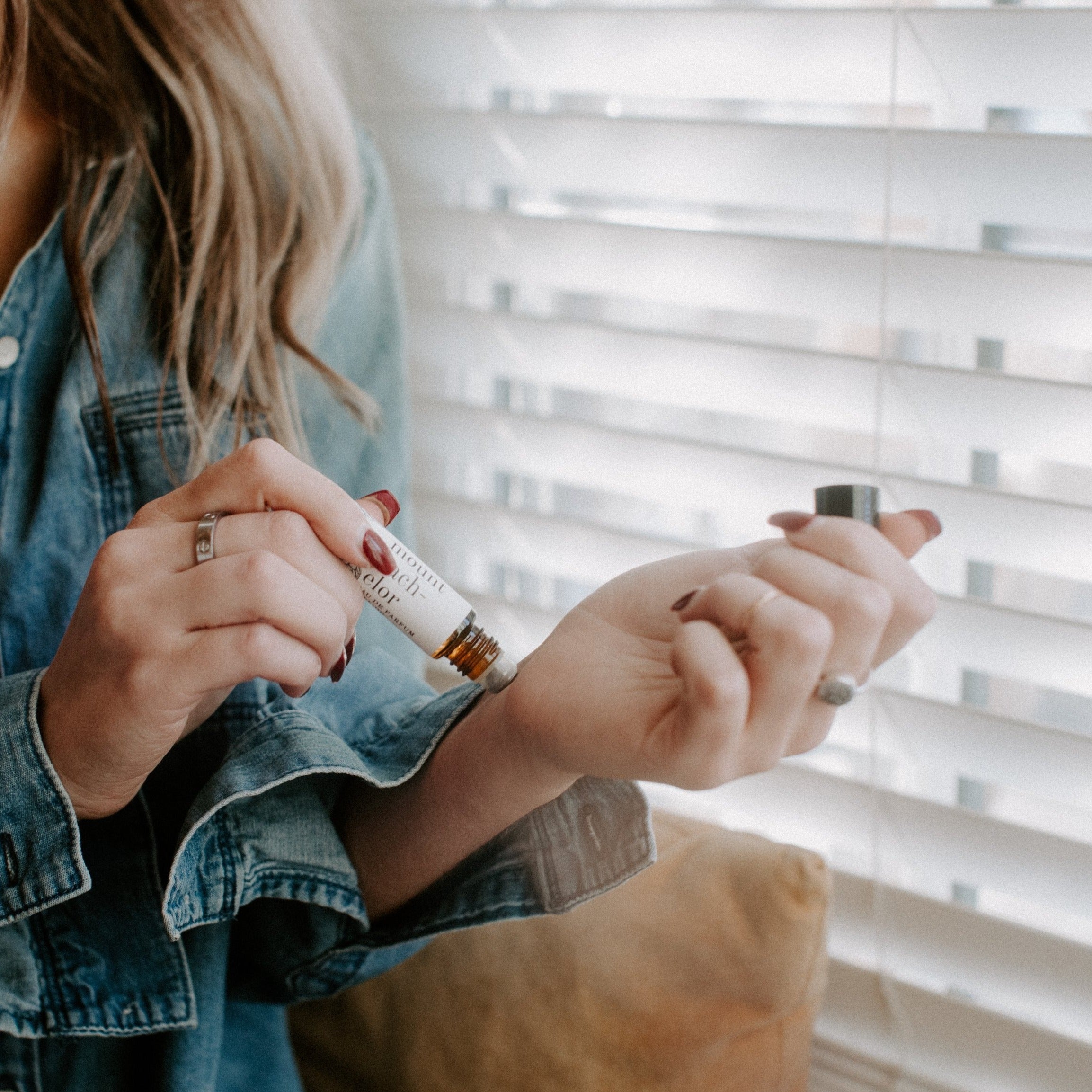 Mount Bachelor roll-on perfume being applied to women's wrist