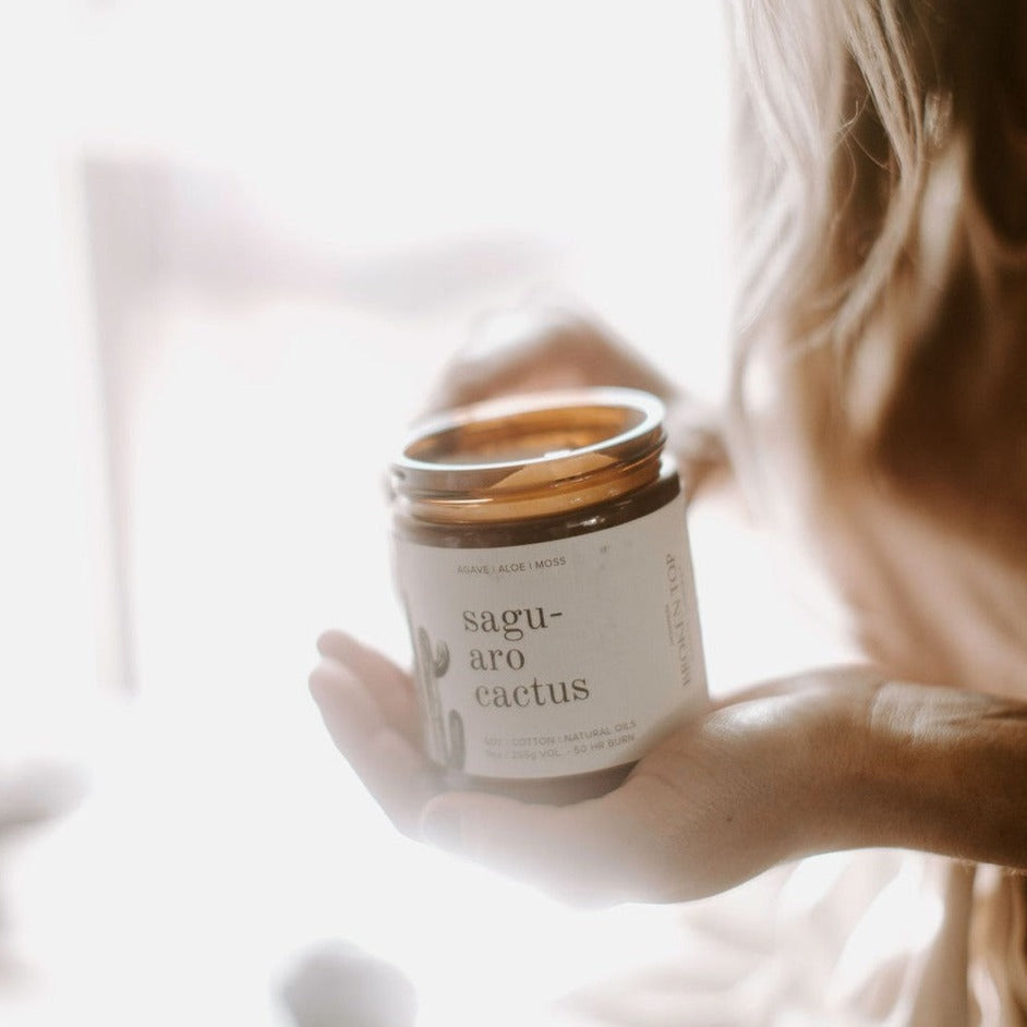 9oz Saguaro Cactus candle einf held in women's hand