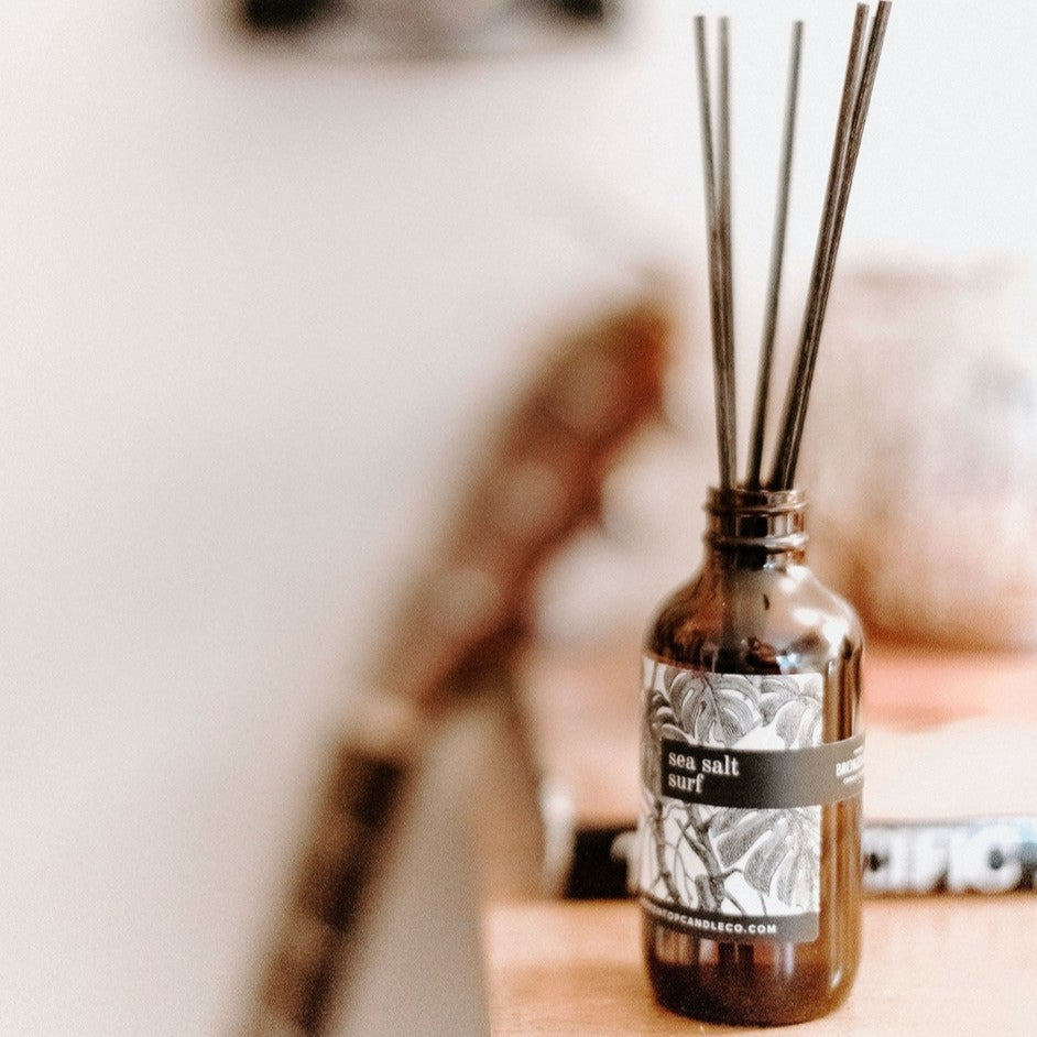 Sea Salt Surf Reed diffuser on wood table