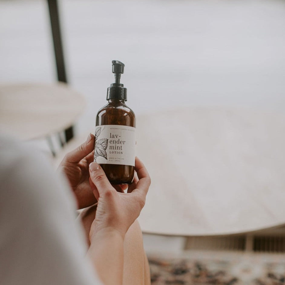 Lavender Mint 8oz lotion being held by women's hands