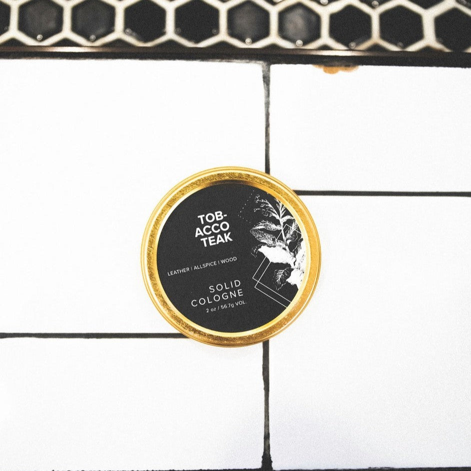Sitka Woodland solid cologne on tile
