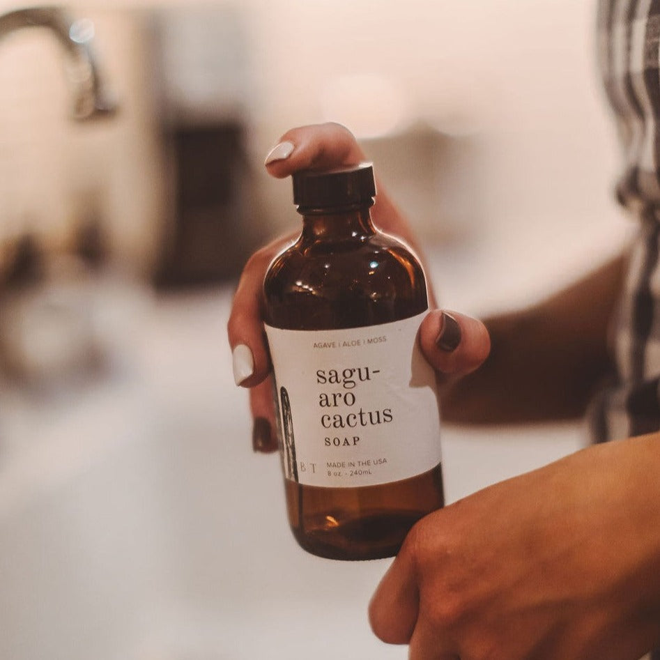 Saguaro Cactus 8oz liquid soap being held in women's hand