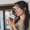 9oz Maple Harvest candle being smelled and held by women