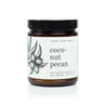 9oz Coconut Pecan Soy Candle on white background. 
