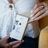 Apricot Bloom Bar Soap being unboxed by woman's hands. 