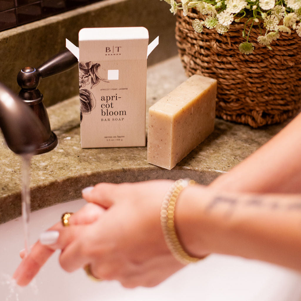 Apricot Bloom Bar Soap on bathroom sink counter. 