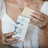 Fresh Squeezed Bar Soap being unboxed by woman's hands. 