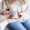 Two women holding 9oz 'Blue Fleur' Soy Candle