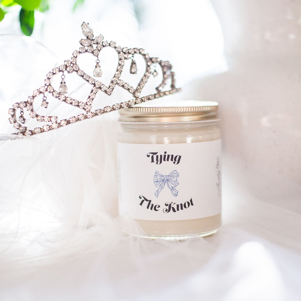 9oz 'Tying the Knot' Soy Candle on White table surrounded by white veil and tiara