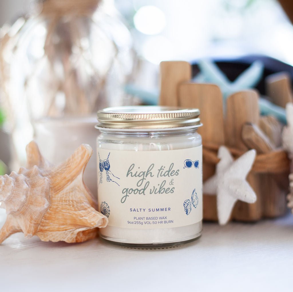 9oz 'High Tides & Good Vibes' Soy Candle on white table surrounded by sea shells