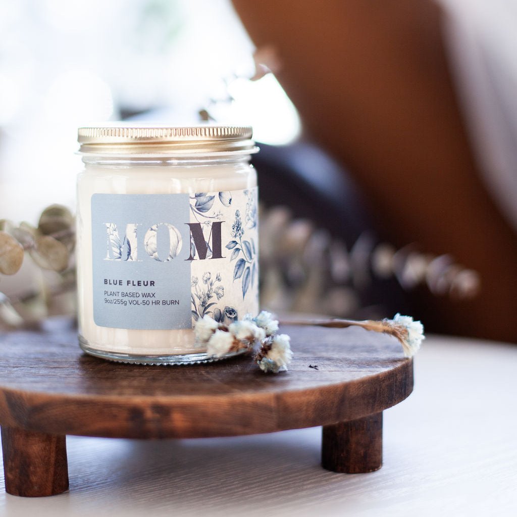 9oz 'Blue Fleur' Soy Candle on wooden stand on white table