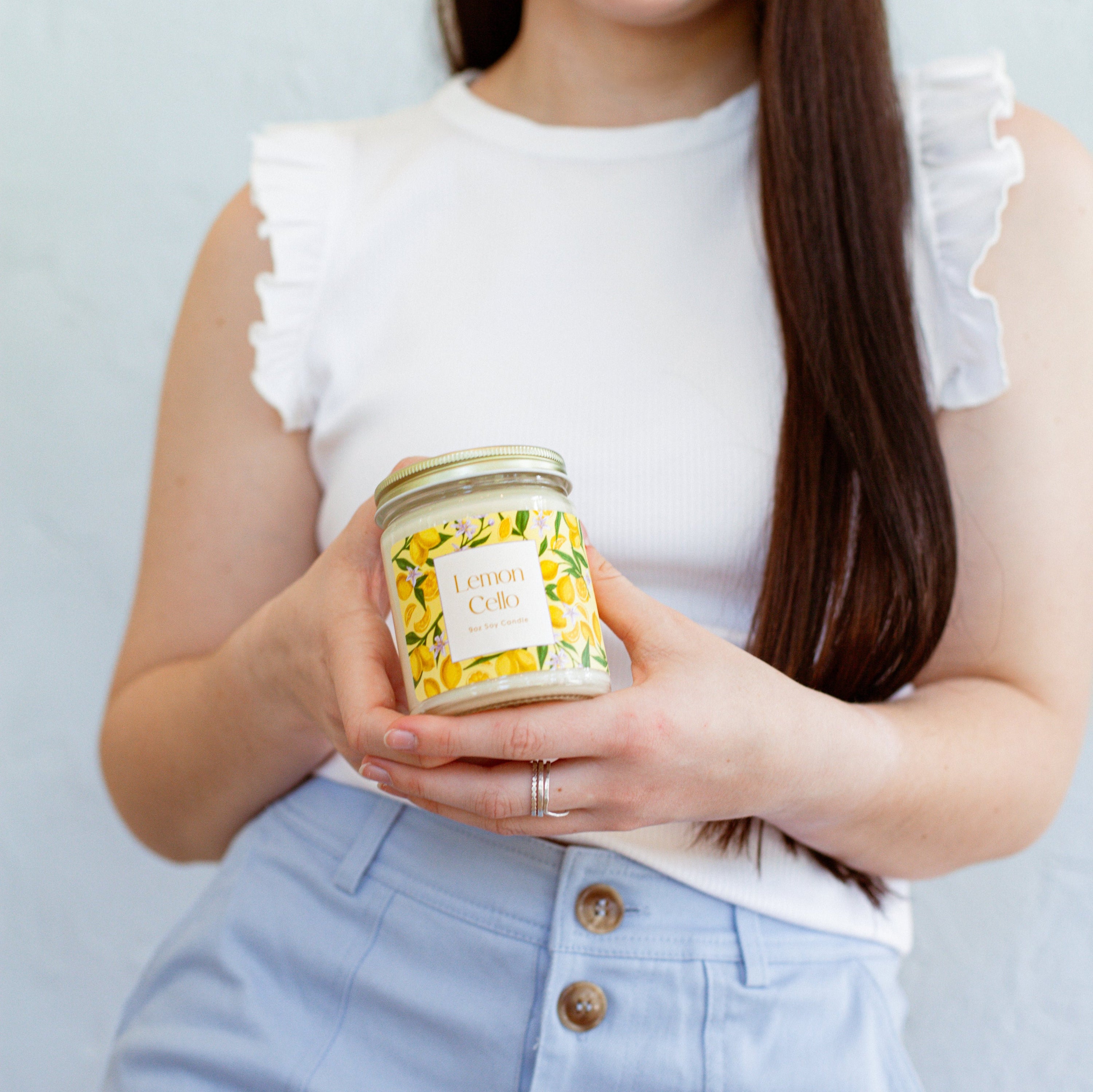 Young woman holding 9oz 'Lemon Cello' Soy Candle