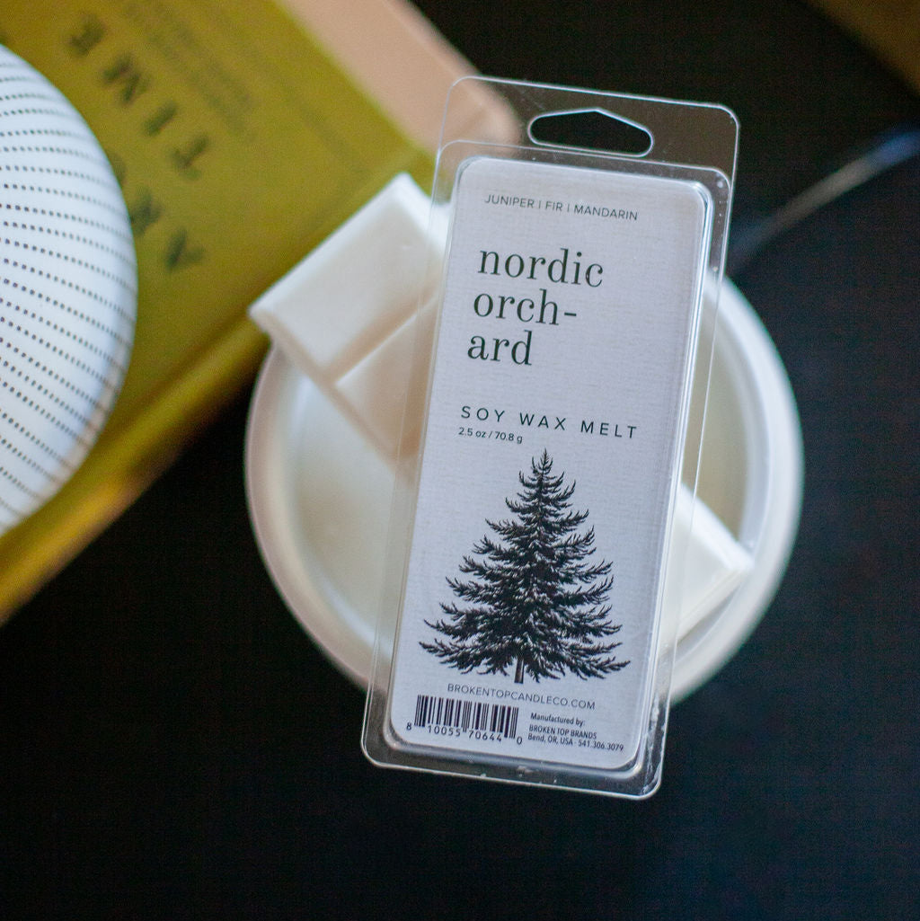 Nordic Orchard Wax Melts on a side table. 