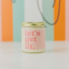 9oz 'Let's Get Lit' Soy Candle on white countertop. 