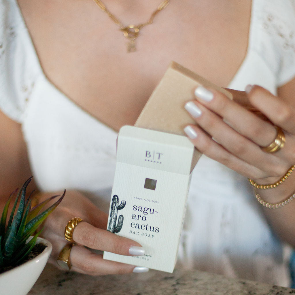 Saguaro Cactus Bar Soap being unboxed by woman's hands. 