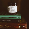 4oz Bayberry Cedar candle on books