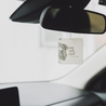 Sea Salt Surf Car Freshener hanging from a rearview mirror. 