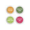 Apricot Bloom, Pineapple Sage, Citrus Herbed Tonic, and Rio Ruby Red Scent Samples on white background. 