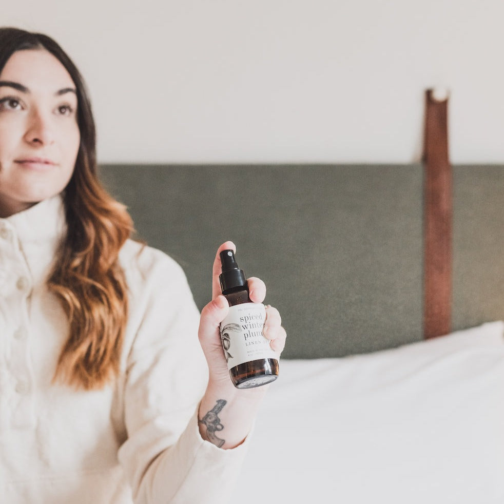 4oz Spiced Winter Plum spray being held by women