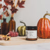 4oz Pumpkin Spice candle on good next to pumpkins