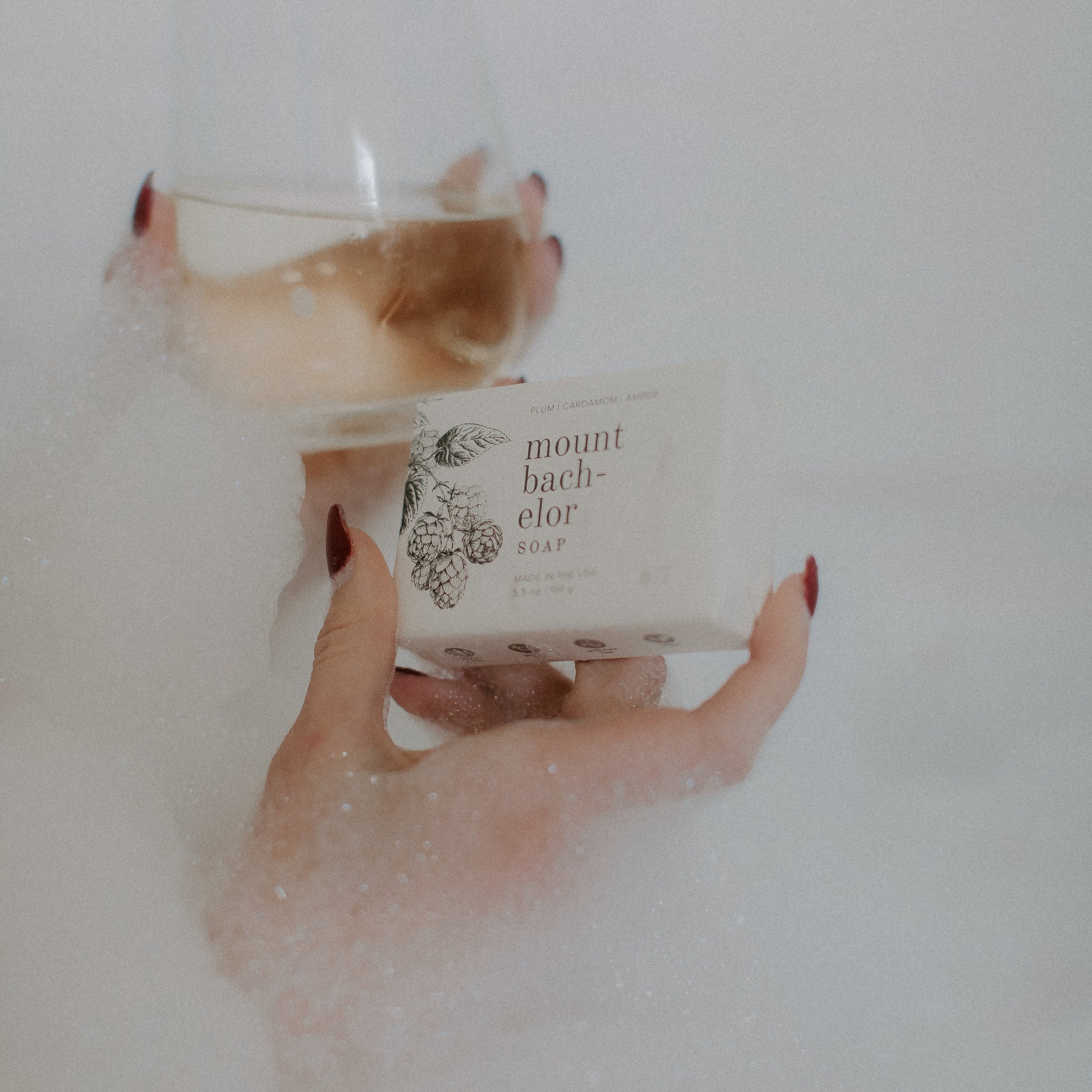 Mount Bachelor bar soap in women's hand and wine glass
