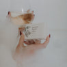 Mount Bachelor bar soap in women's hand and wine glass