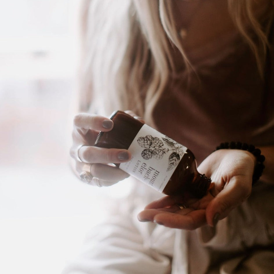 Mount Bachelor 8oz lotion being dispensed by women's hand